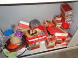 a lot of boxes and other items on the shelf