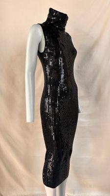 a black sequinized dress with a high neck and long sleeves