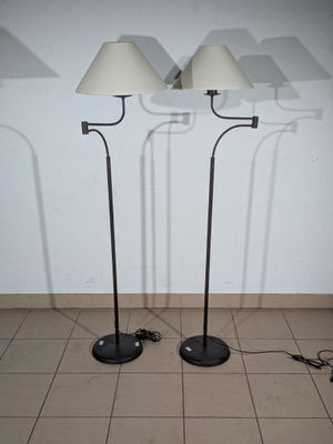 two lamps that are on the floor next to each other