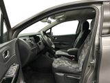 the interior of a car with the door open and the driver ' s seat up