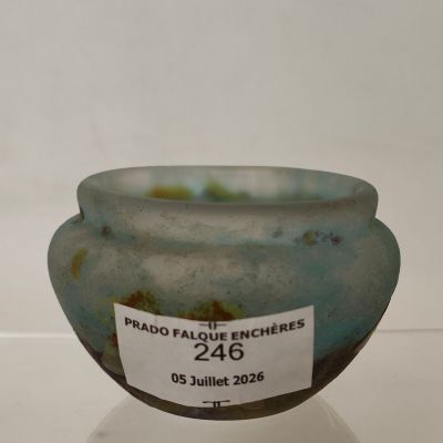 a glass bowl with a label on it that says prado failure enchirres