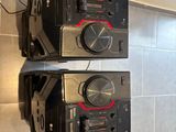 two speakers sitting on top of each other in the kitchen