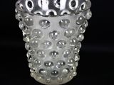 a clear glass vase with a lot of bubbles on it