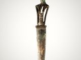 a bronze dagger with a bird on top of it