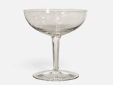 a wine glass that is sitting on a table