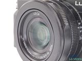 a black camera with a lens attached to it