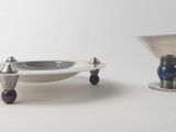 two bowls and a bowl on a white table