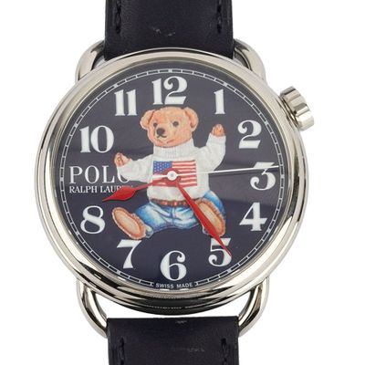 a close up of a watch with a teddy bear on it