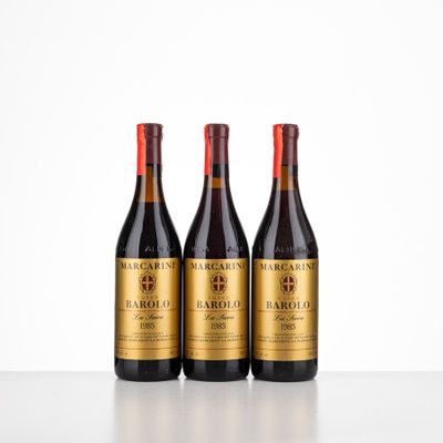 three bottles of wine sitting on top of a table next to each other