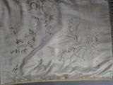 a picture of a table cloth with birds and flowers on it