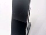 a cell phone that is sitting on top of a stand