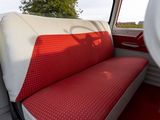 a red and white seat in the back of a truck