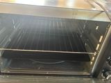 a toaster oven that is open on the counter