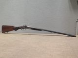 a rifle that is sitting on top of a table