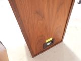 a wooden cabinet with a yellow label on it