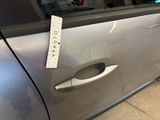 a sticker on the door handle of a car