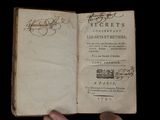 someone is holding a book with a handwritten title on it