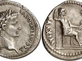 a silver coin with an image of a woman on it