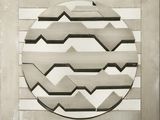 une photo représentant un motif circulaire sur un mur
