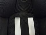 a close up of the seat of a car seat with a black and white stripe on it