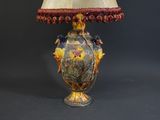 a lamp that is sitting on a table with a lamp shade on it
