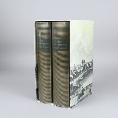 two books sitting on top of each other in front of a gray background