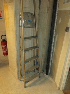 a ladder leaning against a wall in a room