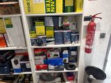 a shelf full of assorted items in a room