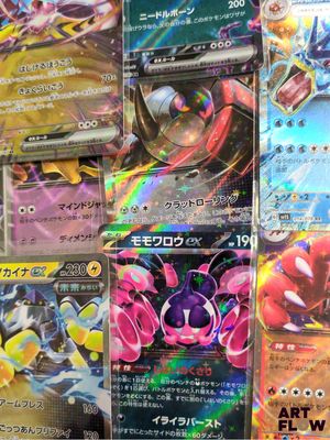 several pokemon cards are displayed on a table in a store