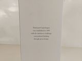 a white box with a quote on it sitting on top of a table