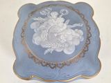 a blue plate with a picture of a woman on it
