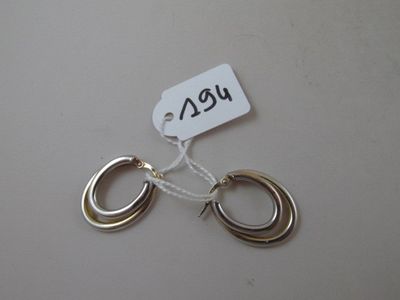a tag with a picture of a pair of earrings on it