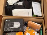 a cardboard box full of electronic equipment on the floor