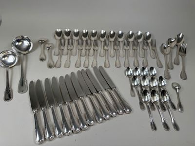 a lot of silver spoons and forks on the table