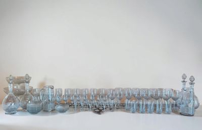 a lot of glass vases sitting on a white table