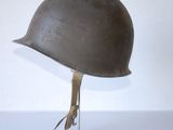 helmet on a stand on a white surface with a white wall in the background