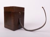 a small wooden box with a wire attached to it