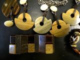 many different pieces of jewelry that are on a table