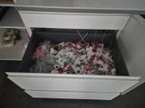 a drawer full of candy and a stuffed animal