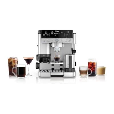 a close up of a coffee machine on a white surface