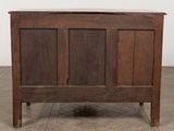 a wooden chest with a door on the top of it