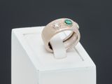 a white box with a ring on top of it