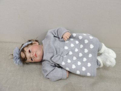 a small child that is laying down on the floor
