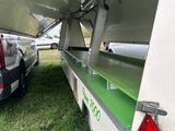 a car that is parked next to a trailer
