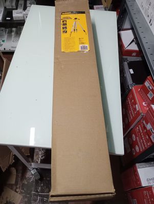 a table that is sitting in the middle of a pile of boxes