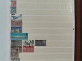 a picture of a book with stamps and a pen on it