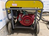an image of a red and yellow generator on a cart
