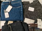 a pile of clothing that is sitting on a table