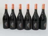 six bottles of wine are lined up in a row