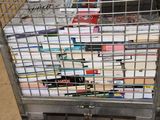 a cart full of books sitting on the floor